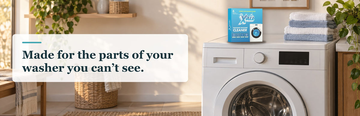 X-All Washing Machine Cleaner box on top of a front-loading washer beside folded towels, with the text: Made for the parts of your washer you can’t see.