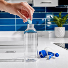 X-All cleaning tablet beside the Multi-Purpose Spray bottle